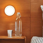 Compact Curved Wall Light - White Version on Wood Panelled Wall