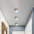 Compact LED Flush Ceiling Light with Wood-Effect Accent - Blue Finish Row in Hallway