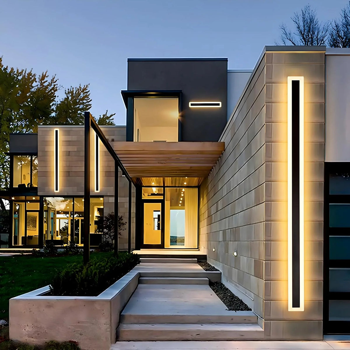 Slim Rectangular Outdoor Wall Light - Lit Along Entrance Path at Dusk