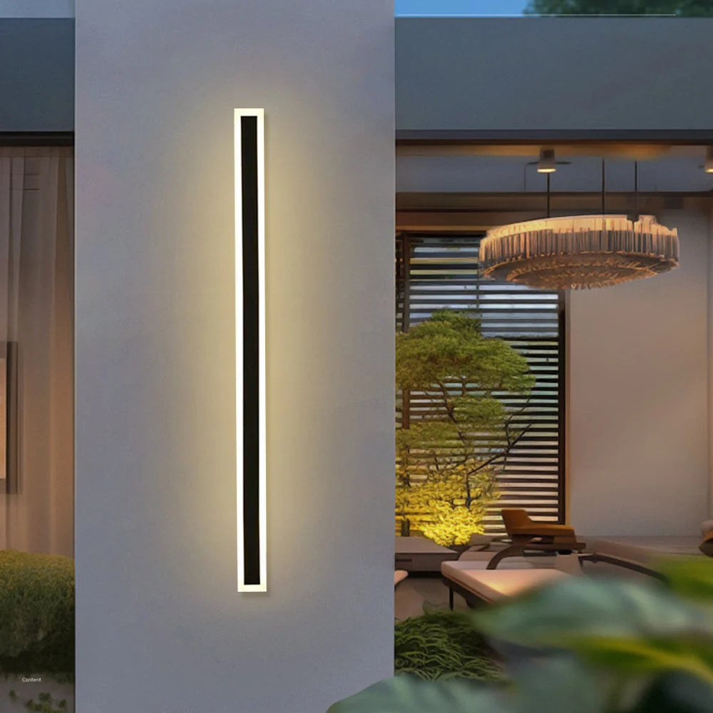 Slim Rectangular Outdoor Wall Light - Lit on Pillar Beside Courtyard