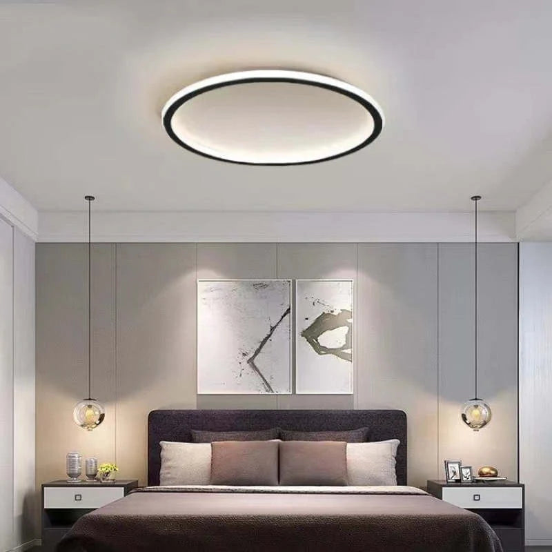 Round LED Flush Ceiling Light - Black Ring Above Bed