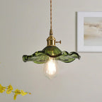 Floral Glass Pendant Light with Brass Fitting - Green Glass Against Pale Wall
