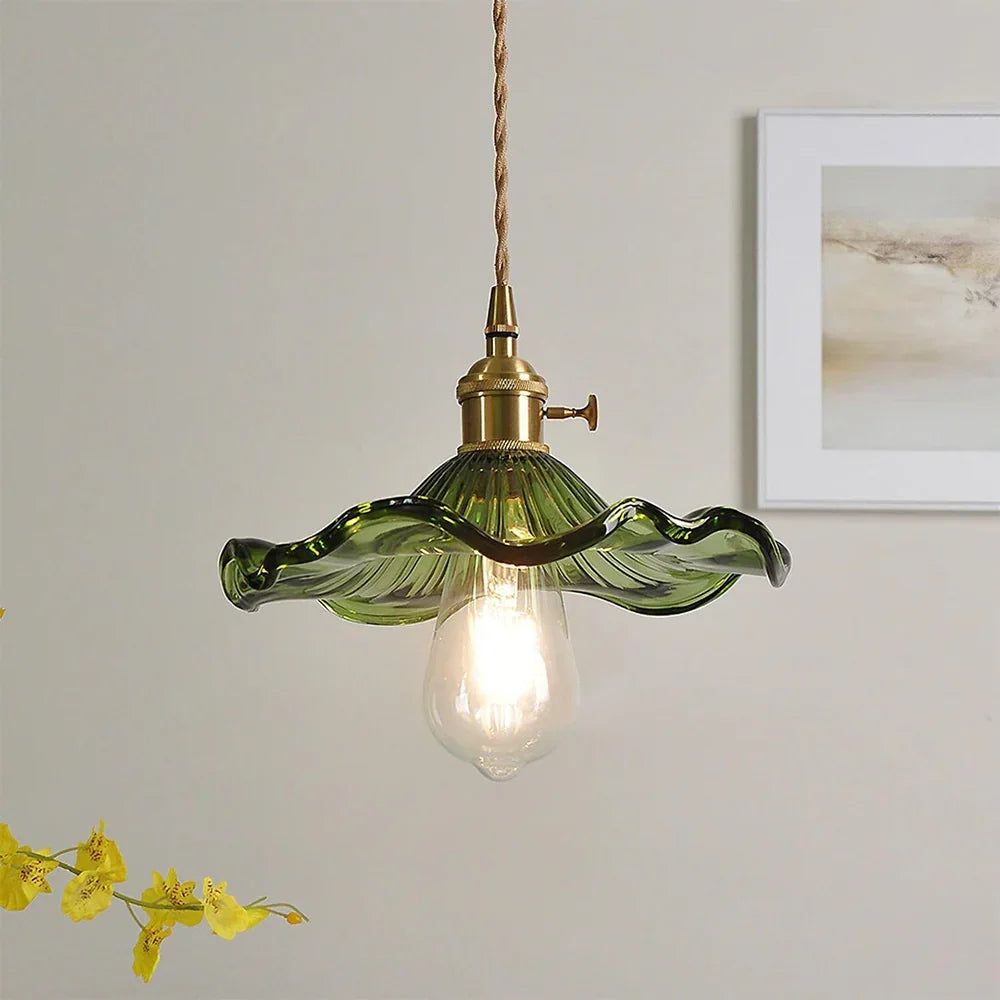 Floral Glass Pendant Light with Brass Fitting - Green Glass Against Pale Wall
