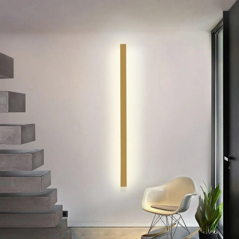 Slim Linear LED Wall Light - Gold Finish Mounted Vertically Beside Stairs
