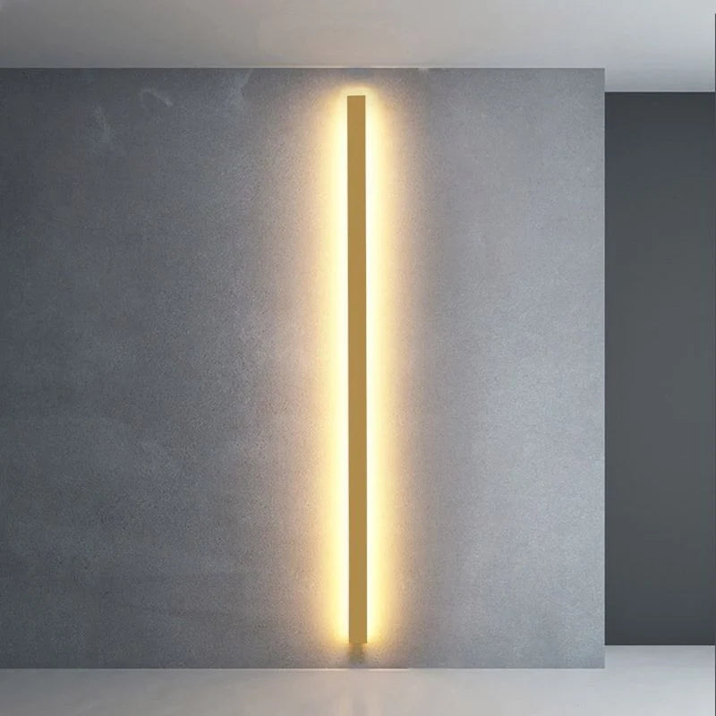 Slim Linear LED Wall Light - Gold Finish Vertical on Concrete Wall