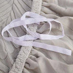 Stretch Jacquard Sofa Cover - Close-Up of Elasticated Hem and Ties