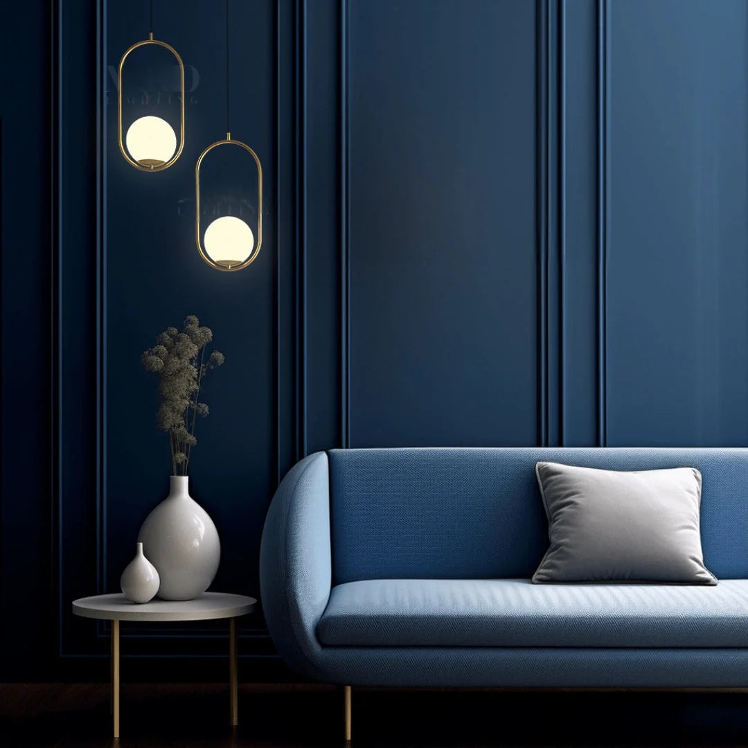 Opal Glass Cage Pendant Light - Two Gold Oval Frames Beside Blue Sofa