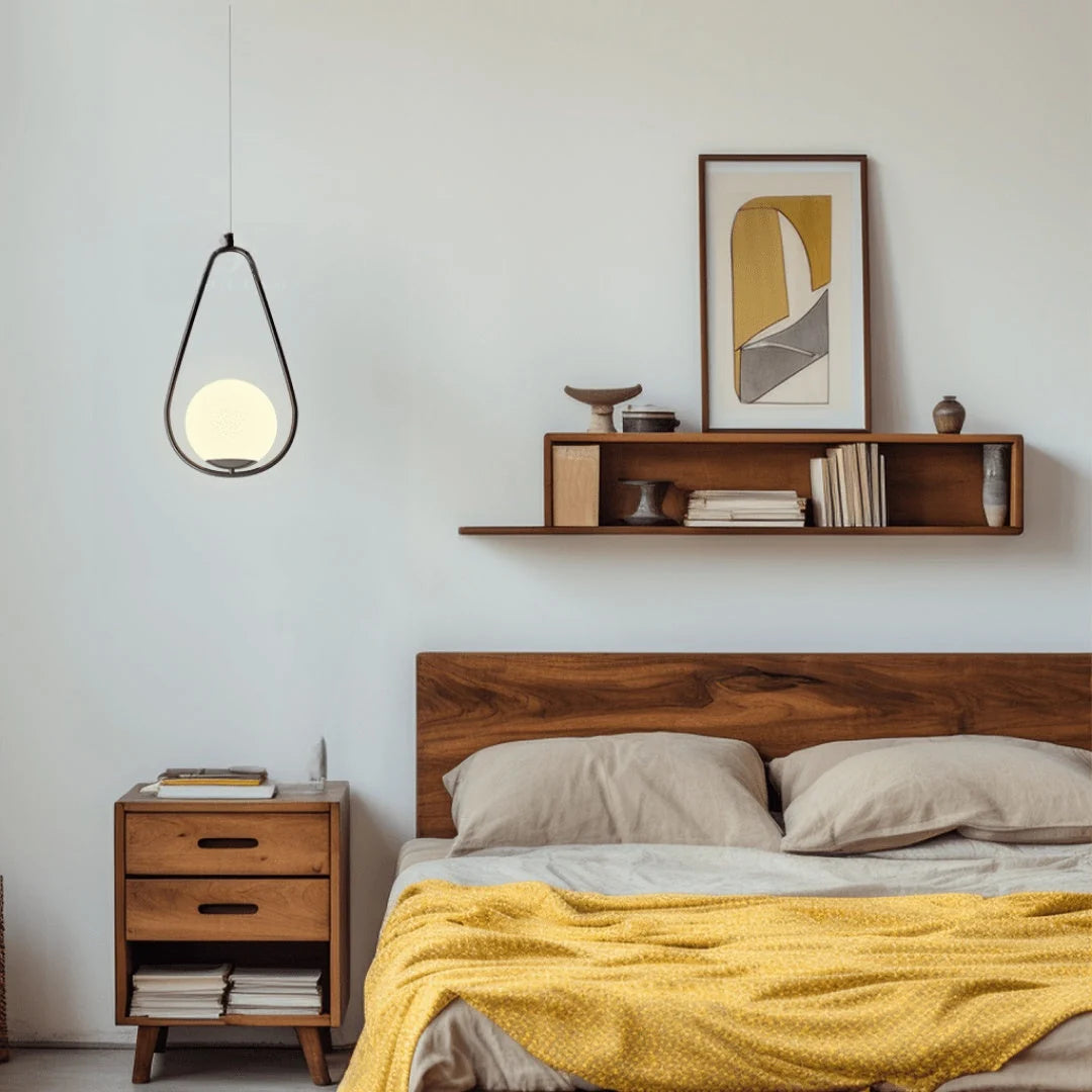 Opal Glass Cage Pendant Light - Black Teardrop Frame Above Bedside Table