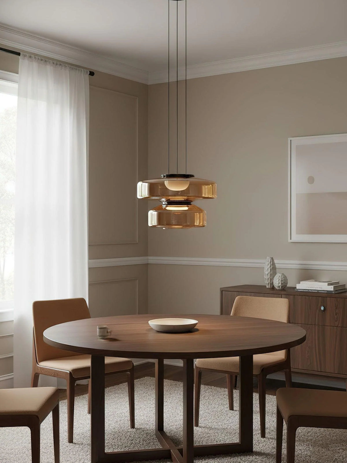 Tinted Glass Pendant Light - Amber Three-Tier Above Round Dining Table