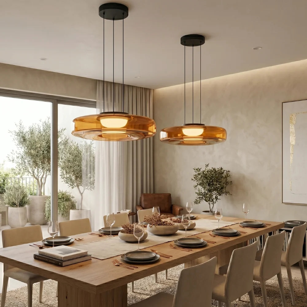 Tinted Glass Pendant Light - Pair of Amber Pendants Above Long Dining Table