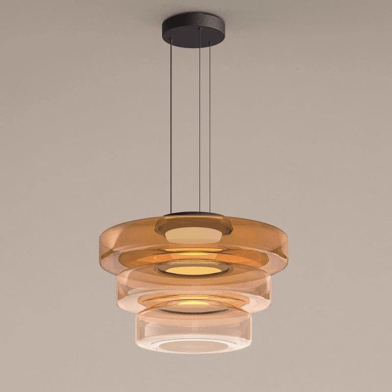 Tinted Glass Pendant Light - Amber Three-Tier on Grey Background