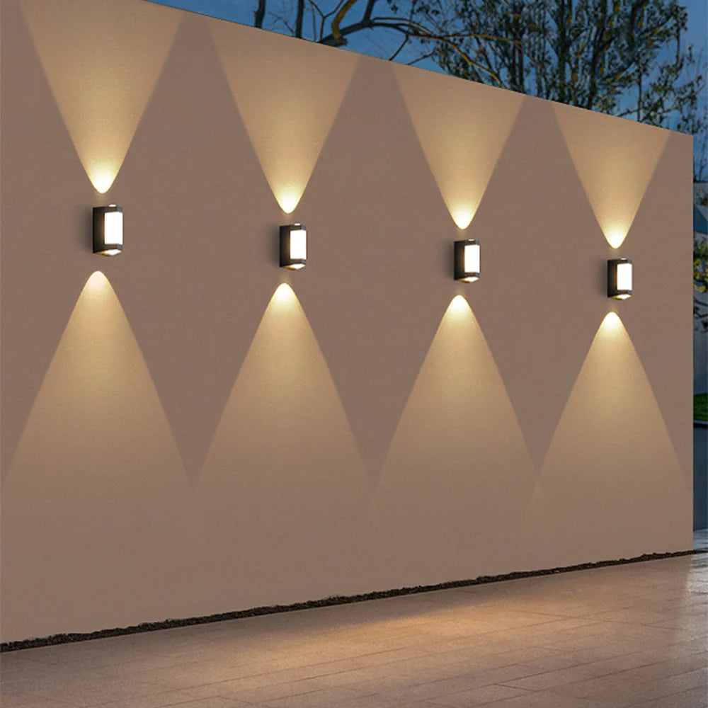 Up and Down Outdoor Wall Light - Row of Lights on Garden Wall at Dusk