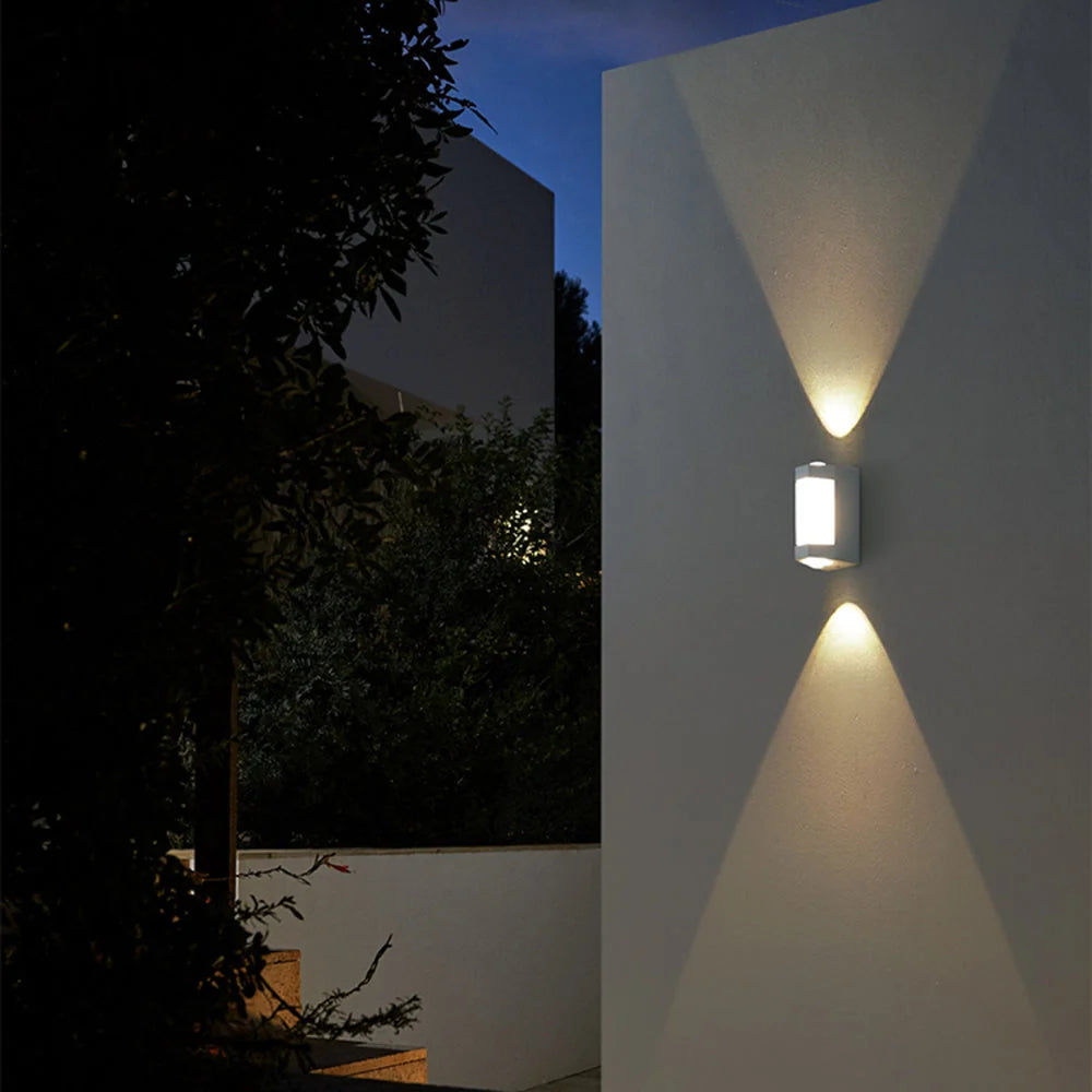 Up and Down Outdoor Wall Light - White Finish Lit on Exterior Wall at Night