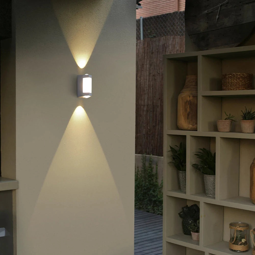 Up and Down Outdoor Wall Light - White Finish Lit Beside Shelving