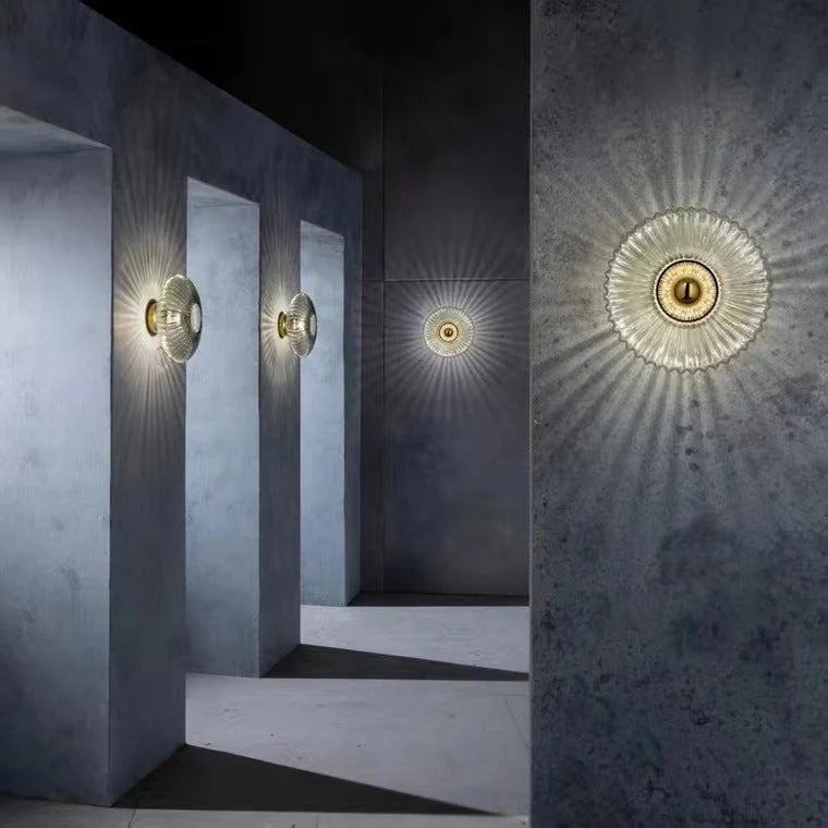 Ribbed Glass Disc Wall Sconce - Smoke Grey Glass Lit on Concrete Wall