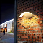 Modern Outdoor LED Wall Light - On Brick Wall at Night