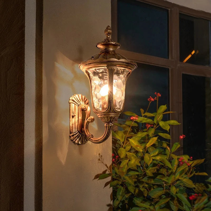 Ripple Glass Outdoor Wall Lantern - Bronze Finish Beside Window, Lit