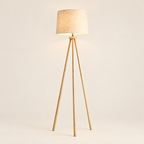Wooden Tripod Floor Lamp with Linen Drum Shade - Lit on Cream Background