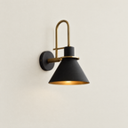Mid-Century Wall Sconce with Cone Shade and Brass Arm - Black Shade on Cream Wall