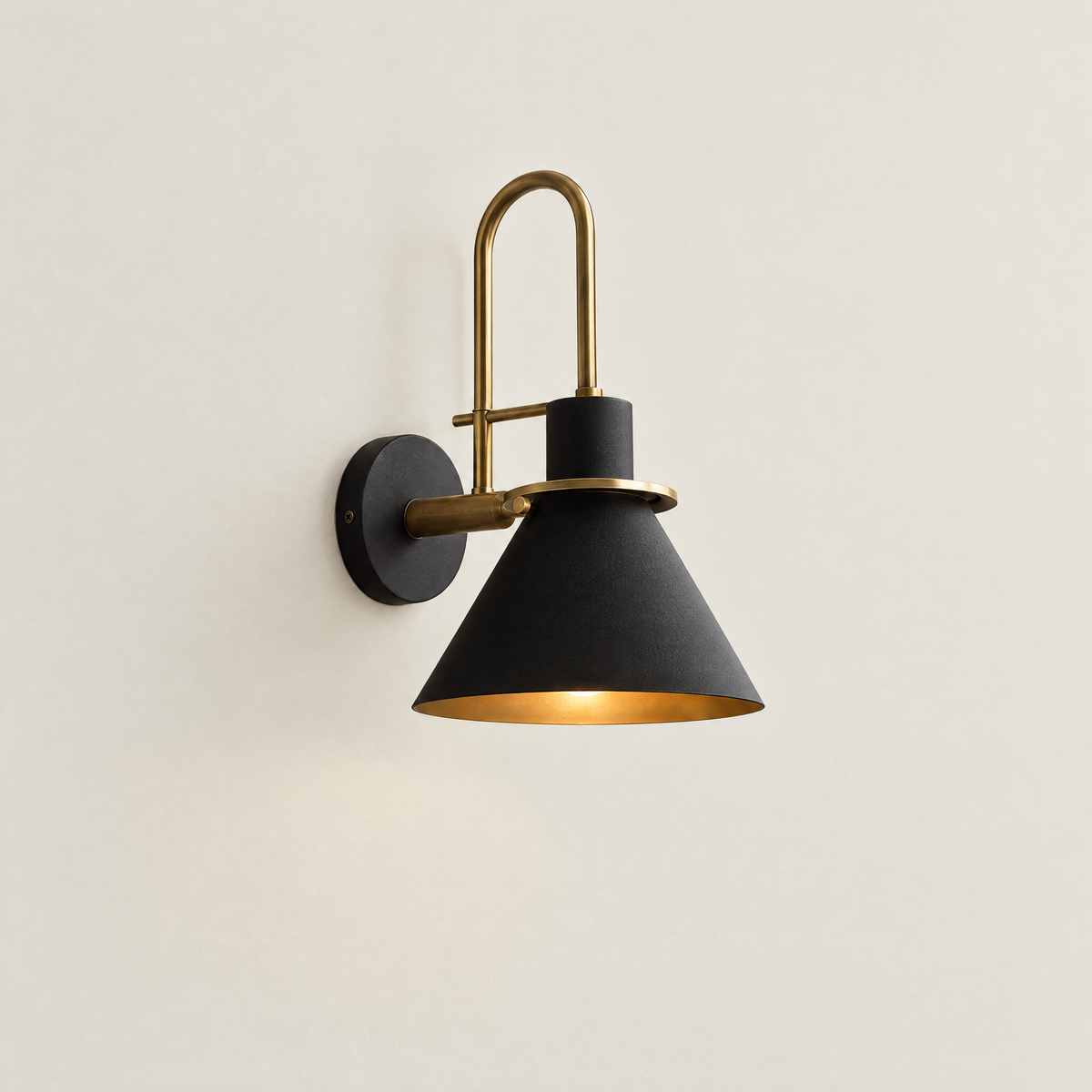 Mid-Century Wall Sconce with Cone Shade and Brass Arm - Black Shade on Cream Wall