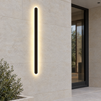 Black Linear Outdoor Wall Light - Lit on Stone Wall by Door