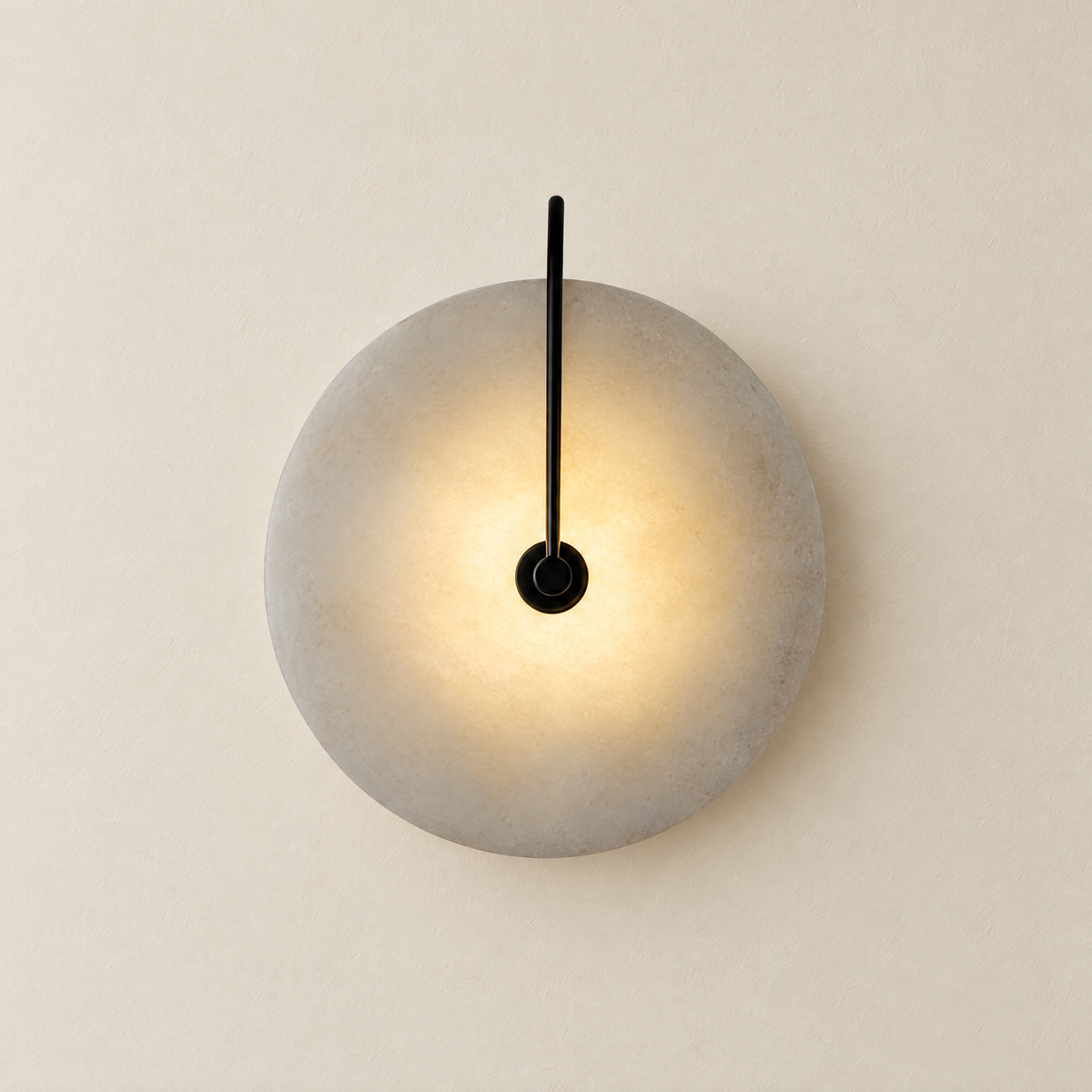 Round Marble Wall Sconce with Integrated LED - Front View, Lit, on Off-White Wall