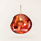 Molten Mirrored Globe Pendant Light - Red Finish, Lit, on Off-White Background
