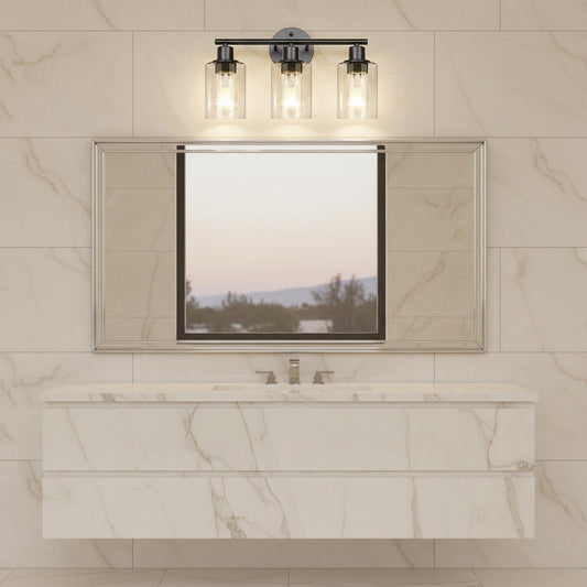 Lorvali industrial 3-light glass vanity wall sconce mounted above a bathroom mirror with marble tile background