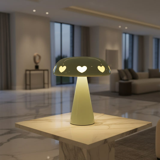 Lorvali Amore mushroom table lamp in sage green polycarbonate with heart-shaped cutouts casting a warm ambient glow.