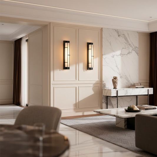 Lorvali Art Deco wall sconces with black copper frames and marble shades installed on a beige living room wall.