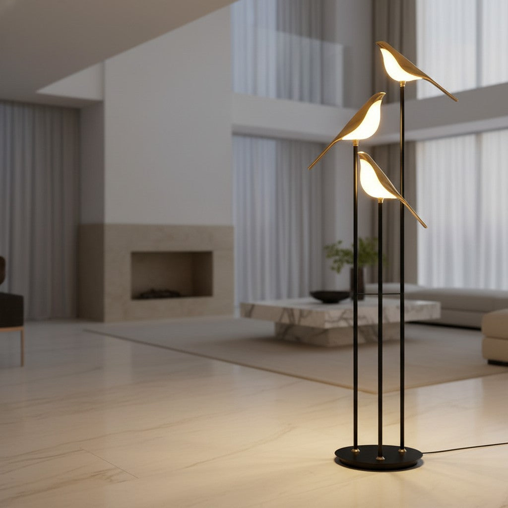 Lorvali contemporary floor lamp with three gold magpie-shaped LED lights and black metal stems in a modern living room.