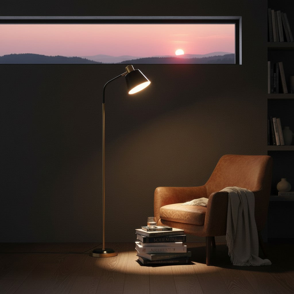 Lorvali 62-inch black and gold metal floor lamp with a rotatable cone shade, illuminating a cozy reading nook.