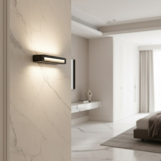 Lorvali minimalist black aluminum LED wall light bar with white acrylic shade mounted on a marble wall in a bedroom