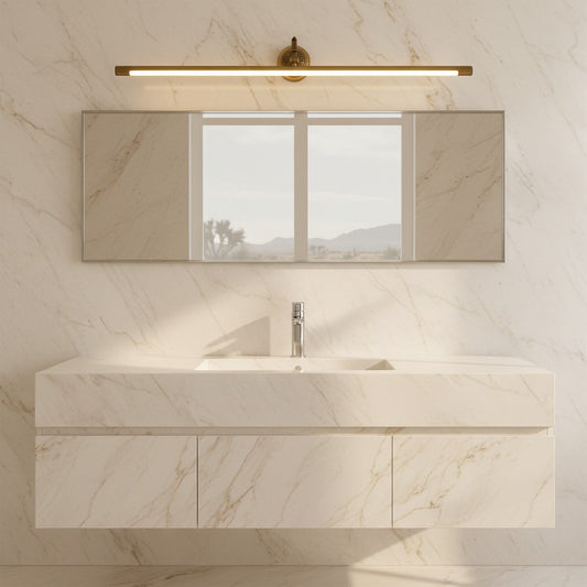 Lorvali brass LED vanity light bar mounted above a bathroom mirror with marble wall and vanity cabinet.