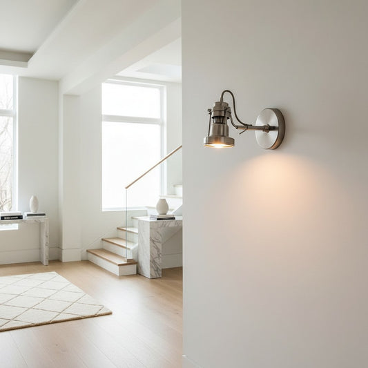 Lorvali brushed nickel wall sconce with rotatable design and honeycomb anti-glare filter in a modern living room