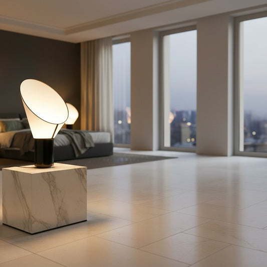 Lorvali Cargo Horn table lamp with a white conical shade and black base, displayed on a marble cube in a modern room.