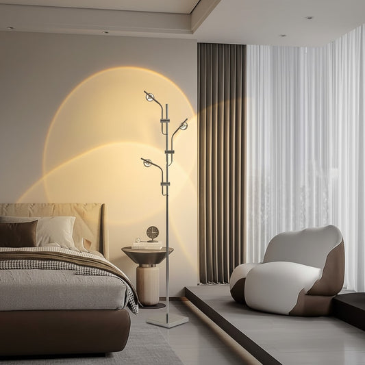 Lorvali industrial chrome floor lamp with adjustable multi-angle heads casting warm light arcs in a modern bedroom.