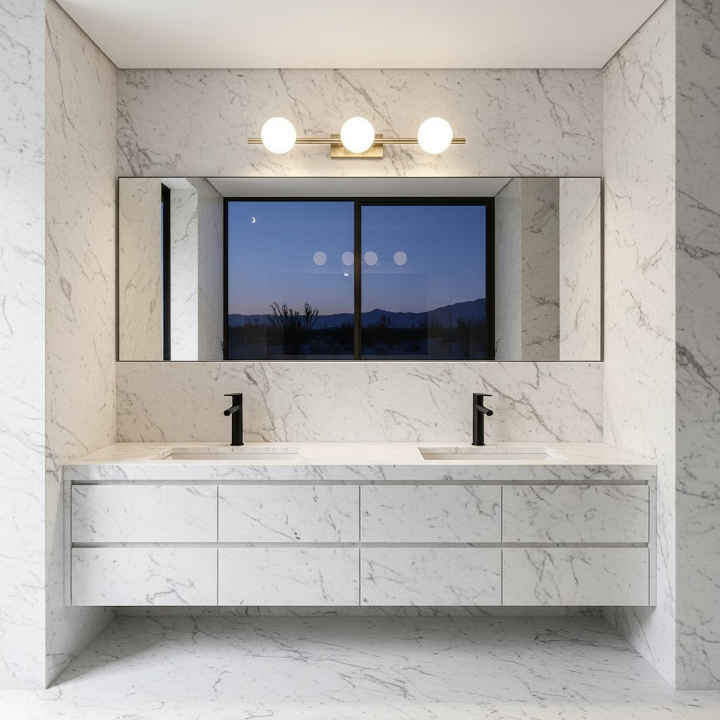 Lorvali modern copper LED vanity light bar with three milky white glass globes mounted above a marble bathroom mirror.