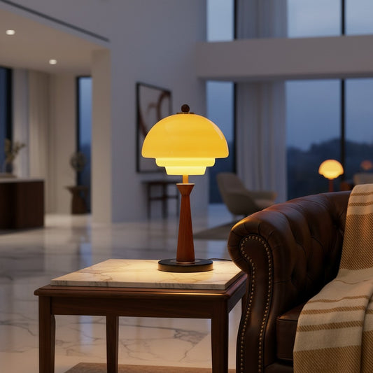 Lorvali Elio accent table lamp with a yellow glass dome shade and walnut wood stem on a black marble base.