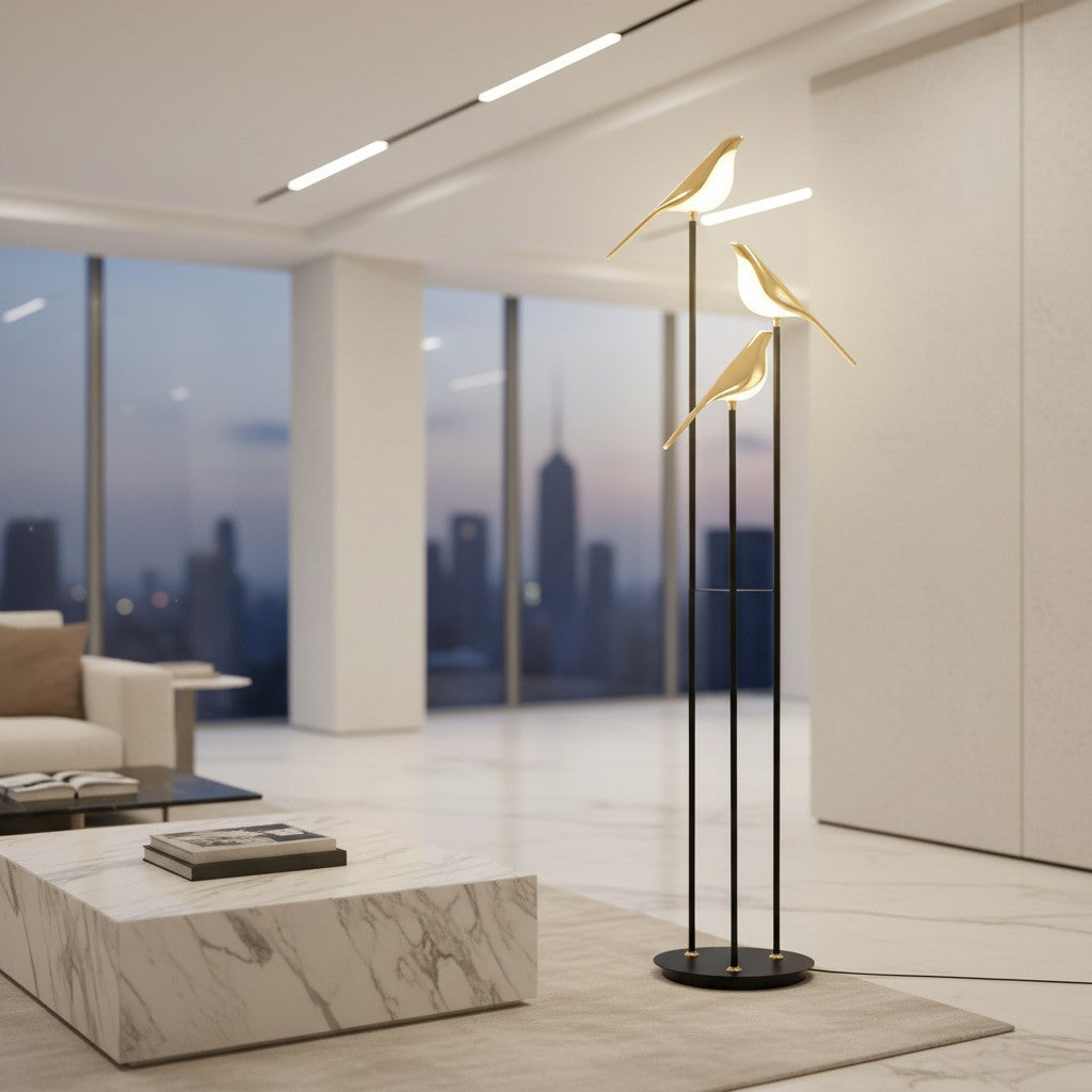 Lorvali bird floor lamp with three gold magpie figures and white acrylic shades in a modern minimalist living room.