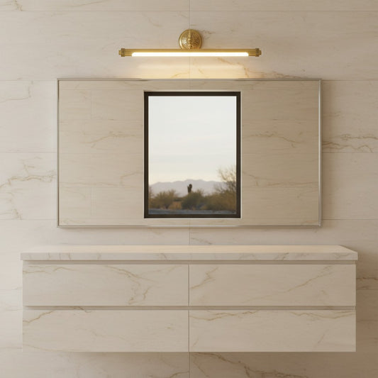 Lorvali gold bathroom vanity light with adjustable copper arm mounted above a rectangular mirror in a marble bathroom