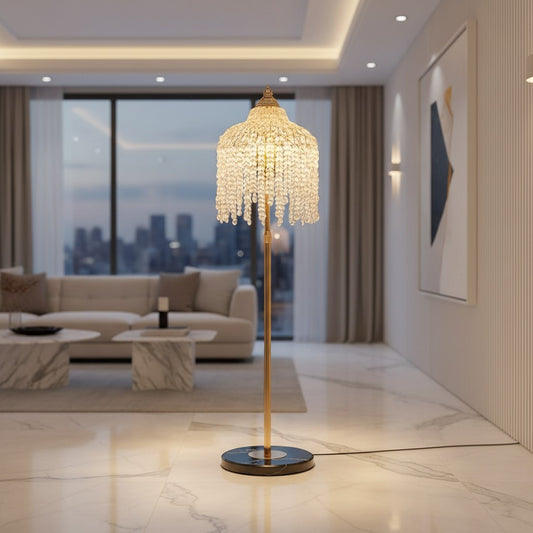 Lorvali floor lamp with a French gold hardware frame and cascading transparent crystal shade in a modern living room.