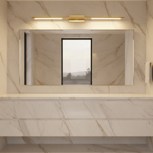 Lorvali modern gold LED vanity light mounted above a bathroom mirror with marble wall tiles.