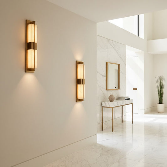 Lorvali modern gold linear wall light with white acrylic shade emitting warm LED glow in a bright hallway