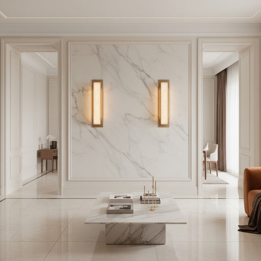 Lorvali gold and marble linear LED wall light fixtures mounted on a white marble wall in a modern living room