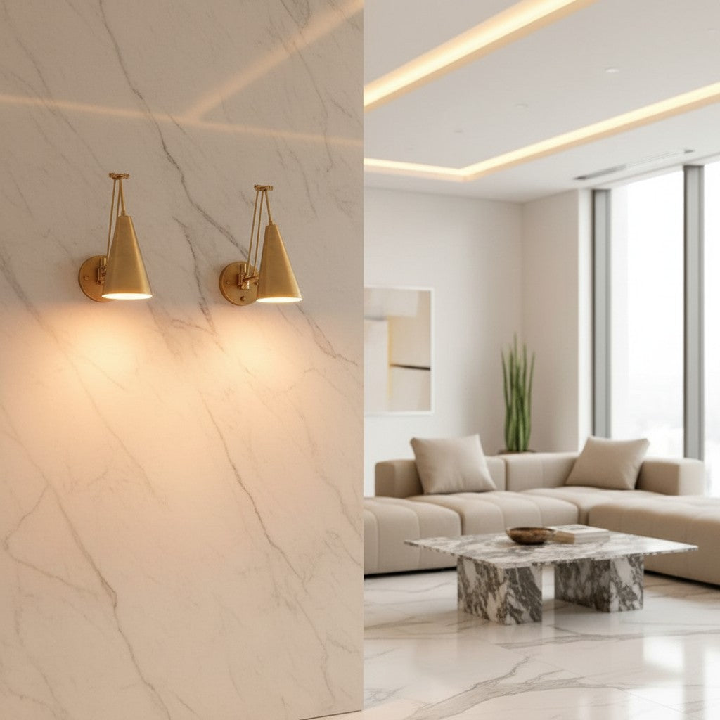 Lorvali gold adjustable swing arm wall sconces mounted on a marble wall in a modern minimalist living room