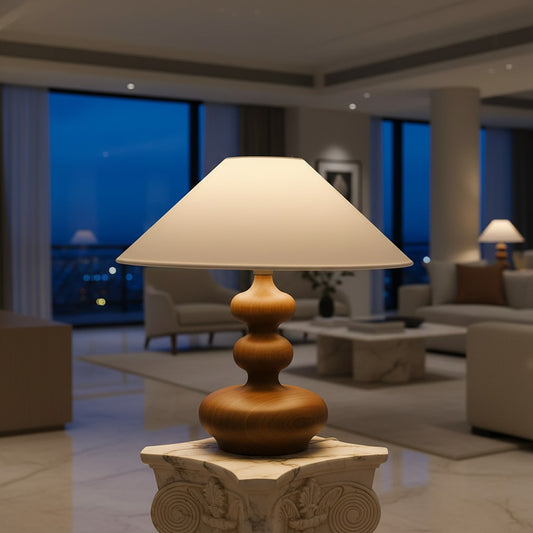 Lorvali Gourdy wooden table lamp with a walnut finish, white fabric shade, and sculptural base on a marble pedestal.