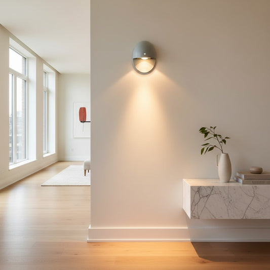 Lorvali oval motion sensor wall lamp in gray aluminum mounted on a modern hallway wall with warm LED lighting