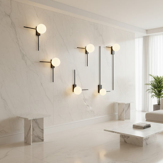 Lorvali retro industrial wall sconces with spherical frosted glass shades and black metal frames on a marble wall.