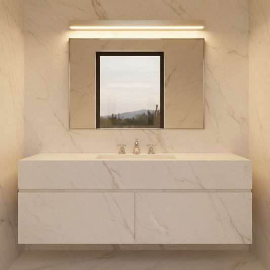 Lorvali slim rectangular LED wall washer light mounted above a bathroom vanity mirror with marble wall tiles.